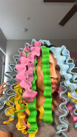 Turning an afro into waves with curlers