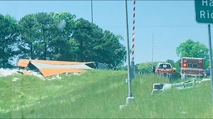 Tractor-trailer overturns at I-264/I-64 on-ramp in Norfolk