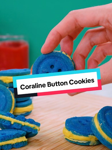 You MUST try these Coraline button cookies! ✨Recipe: Ingredients: • 2 ½ cups all-purpose flour • 1 cup (2 sticks) unsalted butter, softened • 1 cup sugar • 1 large egg, room temperature • 2 tsp vanilla extract • ½ tsp baking powder • ¼ tsp salt • Yellow frosting (for filling) Directions: 1. In the bowl of a stand mixer, cream the butter and sugar together until light and fluffy. Add the egg and vanilla, mixing until smooth. 2. In a separate bowl, whisk together the flour, baking powder, and salt