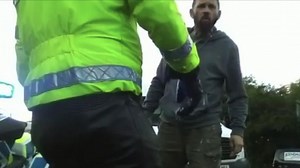 A van driver has been seen confronting Insulate Britain protesters blocking a roundabout on the M25, as he accused them of causing 'damage'.