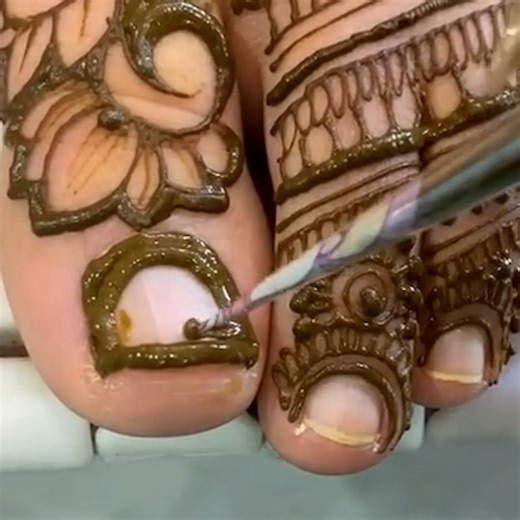 Henna is a plant-derived dye that's been used for body art and cultural celebrations for thousands of years. It can also be used to achieve a semipermanent color on the nails. Henna paste is applied on the nails in a thick and even layer. The nail is covered and left to dry for an hour or overnight. Once dried, the henna is peeled off, revealing a reddish-orange stain on the nails. Results last until the nails grow out. For more, visit: https://www.tiktok.com/@gopihenna https://www.instagram.com