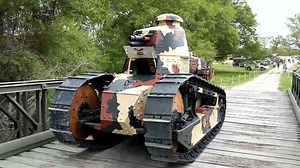 The 1917 French Renault is on the way to the WWI. This is the only operational French Renault in North America. It is driving over a WWII Bailey Bridge | Museum of The American GI