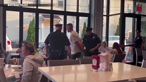 Police officers help man propose to his girlfriend with fake arrest