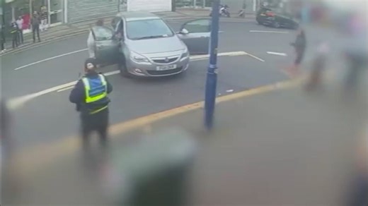 Moment raging motorist mounts pavement in furious row