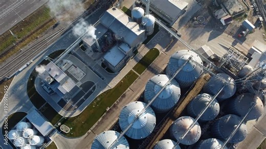 Elevator. Grain elevator. Granary. Large metal structure grain elevator. Storage facility for grain. Top view. Grain storage. Silos. Metal hangar for cereal
