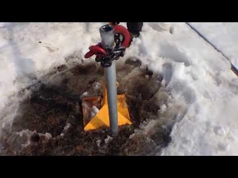 Rhino MP-3 Post Puller pulls fence post from frozen ground