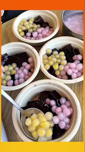 Making various kinds of pudding, combining them together, then drizzling with whipped cream on top.