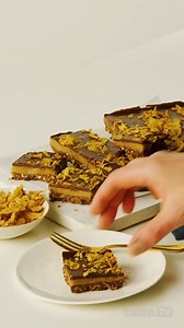 The new iconic 3Cs: Chocolate, caramel, Crunchy nut. Full recipe: https://www.taste.com.au/recipes/crunchy-nut-caramel-slice-recipe/5939iwxw | Taste.com.au