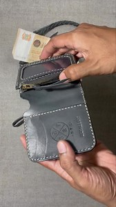L-shaped python skin lightweight bifold wallet w/ fish hook leather rein. Wallet $110 Python skin $20 Leather rein $40 Fish hook $15 Sells for SGD$185 | Reservoir Dayak Leather Goods | Facebook