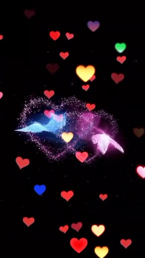 Colorful Animated Hearts Falling on a Dark Background