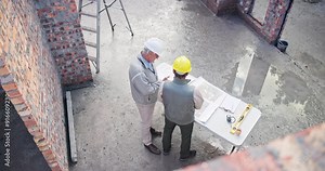 Construction, architect blueprint and men with engineer, development or renovation plan above. Contractor, rooftop and civil engineering paperwork with employees and working on infrastructure project