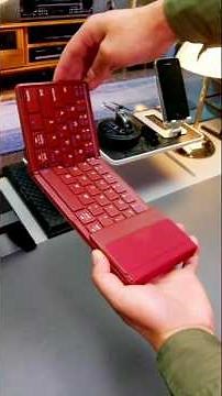 foldable Bluetooth keyboard with a touchpad and numeric keypad