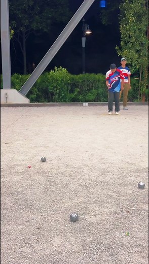 Petanque Game Demonstration Under the Night Sky