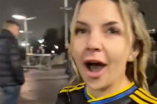 Influencer has full pint dumped over her after taunting angry football fans
