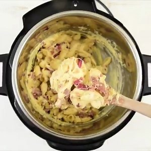 This meat lovers pressure cooker mac and cheese recipe is creamy and filled with bacon and sausage! https://temeculablogs.com/meat-lovers-pressure-cooker-mac-and-cheese/ | The Typical Mom