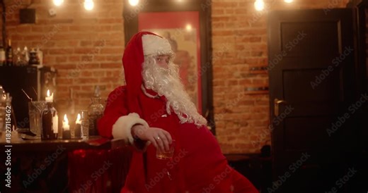 Drunk santa claus drinking whiskey alone at the bar