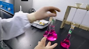 Technology modern scientist analyzing liquid samples in modern lab with microscope, test tubes, and precision. Emphasizing focus during scientific research