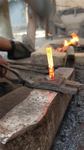 Watch how a blacksmith makes nails from old iron."