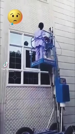 Window Maintenance Using a Scissor Lift