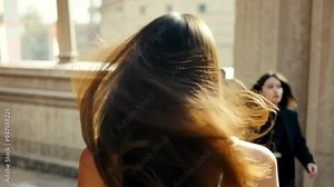 The video begins with a close-up of a woman, then zooms out to show people walking by. Her unnaturally twisted pose adds a mysterious, eerie vibe, ideal for horror or hidden alien themes.