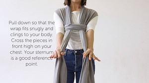 Our Boba Wrap is made of high-quality 4-way stretch material so tying one is different from your average baby wrap. There is just one way to tie for a perfect fit every time - pretty straight forward, huh? 🤗 Grab your wrap and let’s do this together 💪 ✔️Unfold the wrap and find the Boba logo at the center. With the logo facing outward over your navel. ✔️Cross the two outstretched pieces behind your back. Bring each side up and over your shoulders to the front while keeping the fabric stretched