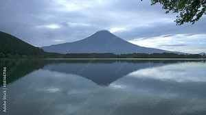 Mount Fuji Timelapse, early summer Morning at Lake Tanukiko with Cap cloud, mountain and lake