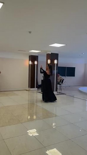 Elegant Dance Performance in Satin Full-Length Dress