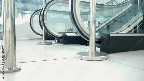A modern escalator in a mall provides easy access for pedestrians with an efficient design