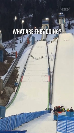 What a team! Meticulously preparing the ski jump hills, while maintaining perfect balance. 👏 #Olympics #WinterOlympics | Olympics
