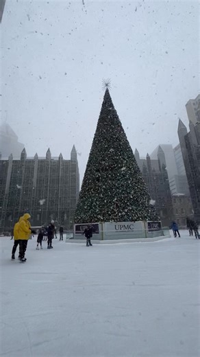 Skating ⛸️ through the snow ❄️ at PPG Place. #pittsburgh #iceskating #snowfall | View Pittsburgh