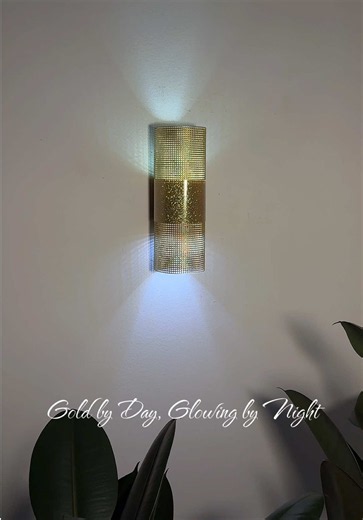 Gold by Day, Glowing by Night ✨ From basic plastic canvas to a modern gold accent light. ✨ Sometimes the simplest materials make the best DIYs. Materials: • Plastic canvas • Gold glitter vinyl sheet • Gold spray paint • Plastic lid • Remote LED light • Hot glue • Thin wire #diy #design #decor #handmade #homedecor