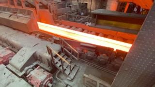 We're heading back into #Teesside Beam Mill (TBM) today. Here the cogging mill is gradually rolling the slab down to a dog bone shape. This stage is taking the 9.5m long slab and producing a 26m beam blank ready for the next stage in the process. #BuildingStrongerFutures #PridePassionPerformance | British Steel