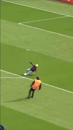 Pitch invader SLIPS OVER on Camp Nou pitch 😆