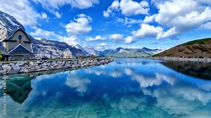 amazing Swiss nature . panoramic view of Fallboden lake with turquoise water and reflections of snowy peaks. Kleine Scheidegg mountain pass famous for hiking in Bernese Alps.