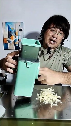 Easy-to-use, durable, modern 3-in-1 cheese and vegetable slicer operated by a hand crank.