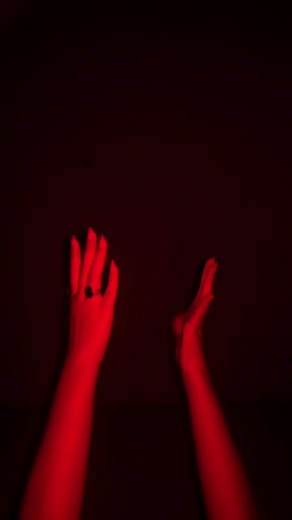 Dramatic Hand Movements in Artistic Lighting