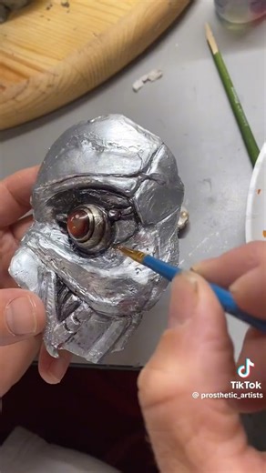 Throwback to this timeless prosthetic art piece! Fixing up the ol’ terminator mask for the Boy! Turned out fire!  Follow us: Instagram: https://www.instagram.com/prostheticartists/ TikTok: https://www.tiktok.com/@prosthetic_artists YouTube: https://www.youtube.com/@ericlindseyprostheticartis3920 #eyeart #terminator #costume #fyp #ocularist #joblife | Prosthetic Artists, Inc. | Facebook