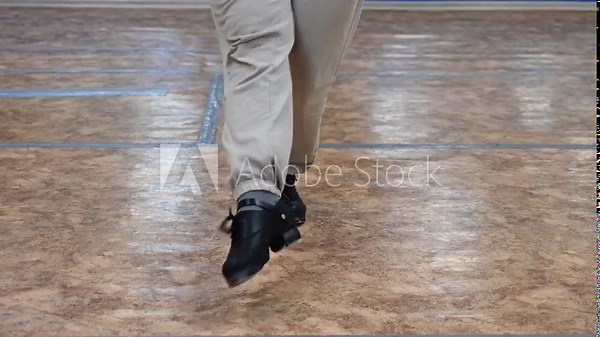 Close-up of male legs dancing traditional Irish stepdance.