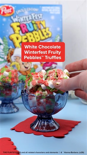 Treat yourself with these White Chocolate Winterfest Fruity Pebbles™ Truffles. ​Recipe here: https://bit.ly/49oYcti | Pebbles Cereal