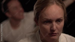 A man being angry at distant woman. A couple having a fight. Jealous man being angry at a woman, shouting.