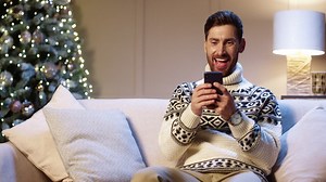 Free stock video - Portrait of joyful young man smiling with surprised face tapping on cell phone feeling excited and happy winning christmas lottery