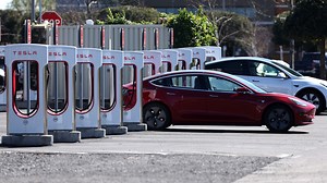 As charging headaches persist, automakers turn to Tesla's Supercharger network