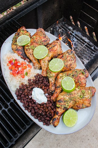 Grilled Mojo Chicken for a Cuban inspired chicken quarters dish! 🍊🍗🔥 . Grilled Mojo Chicken takes smoked chicken to the next level! I took chicken quarters and placed them in a mojo marinated overnight. What is mojo? Well it’s a fresh, citrus with a spice kind of marinade. I actually poured a small bowl of it on the side before adding the rest to a larger bowl with the chicken so that I could use it to baste the chicken as it was smoking. There’s no reason to settle for dry and bland chicken,