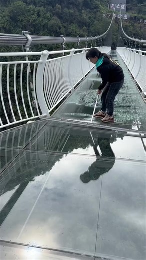 1.5M views · 3.9K reactions | Watch as workers meticulously clean a stunning transparent glass bridge stretching between two majestic mountains. Each careful sweep and wipe transforms the glass into a crystal-clear window to the breathtaking view below. | Sitaram Home Design | Facebook