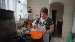 Older Woman Cooking At Home Preparing Food Stock Footage SBV-348508568 - Storyblocks