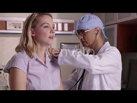 Doctor checking woman's heart with stethoscope | Stock Footage - Envato elements