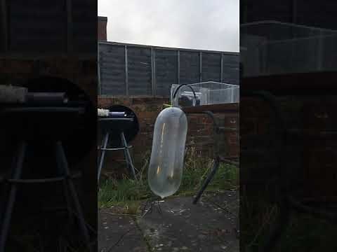 Filling a condom with air until it explodes