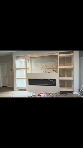 Custom media wall build with fireplace insert, wood paneling. #contractor #fyp #reelschallenge #homerenovation | Davis Installations LLC