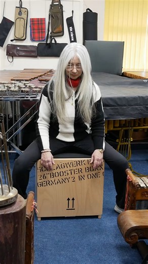 Evelyn Glennie on Instagram: "Well this is a little Christmas present I bought for myself and it's the Booster Boxx made by Schlagwerk and it's extraordinary. It's one of the the deepest cajons I think I've ever come across. It really is incredible, and it's one of those that, you know, whenever you do play cajons you really do feel it throughout the body, but with this one you feel as though you're sinking into a volcano, because the base is just so incredibly responsive. I'm obviously up here 