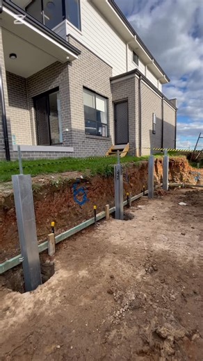 Site Civil & Plumbing on Instagram: "Engineered boundary concrete sleeper retaining wall. Installed in tight access using 100mm thick sleepers and 150UC gal posts. Scope includes: ✅Excavation for retaining wall to boundary ✅Disposal of excess excavated material ✅Pier holes and post install with 32MPa concrete ✅Install as per engineering ✅Welded fence brackets included ✅Install 100mm thick concrete sleepers ✅Ag-line drainage and Geofabric ✅Colorbond Fencing ✅Turfing and full landscape included Fu